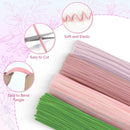 Set of pink and green elastic bands with close-up details on a floral background