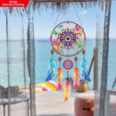 Colorful dreamcatcher with beach view in the background