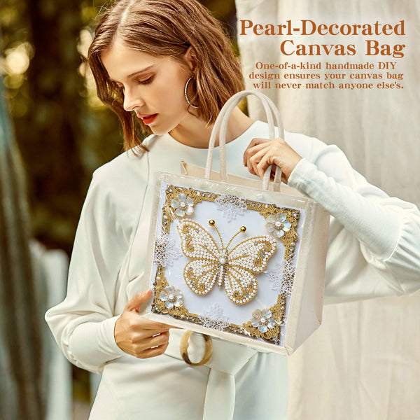 Woman holding a pearl-decorated canvas bag with a butterfly design.
