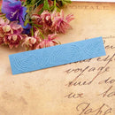 Blue embossed bookmark on an old letter with flowers