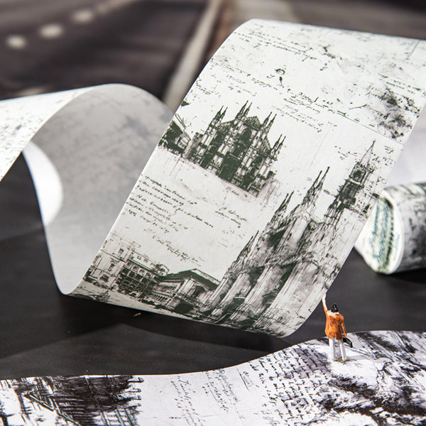 Roll of wallpaper with architectural design and person scaling a wall