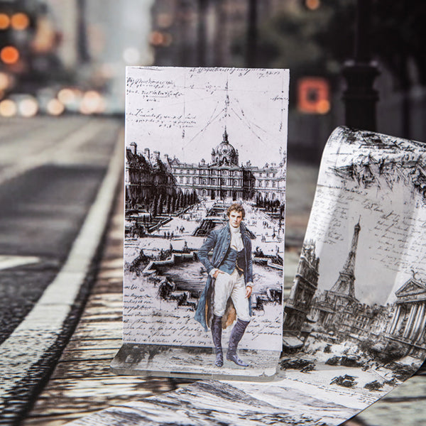 Decorative card with a vintage-style illustration of a man in a cityscape, placed on a reflective surface.