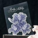 Transparent acrylic block with floral design and text on a dark background