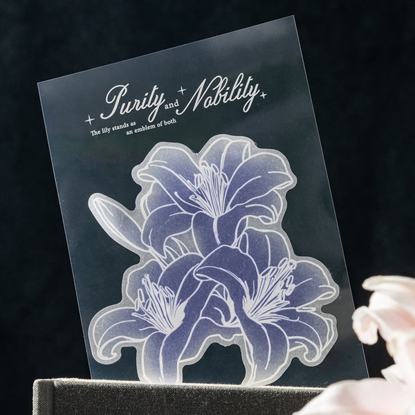 Transparent acrylic block with floral design and text on a dark background