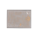 Decorative rectangular plate with gold text and design on a white background