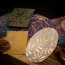 Decorative paper circles with floral patterns on a wooden surface