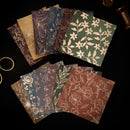 Set of patterned paper sheets on a dark surface