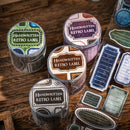 Rolls of handwritten retro label stickers on a wooden surface