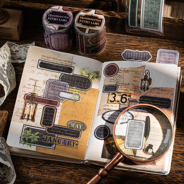 Scrapbook with vintage-style labels and a magnifying glass on a wooden surface
