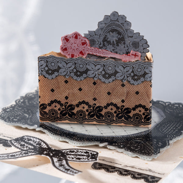 Decorative box with lace detailing on a white background