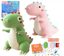 Crocheted dinosaur toys with crochet kit and supplies on a white background