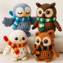 Four crocheted owl toys with scarves on a light background