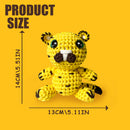 Crocheted tiger toy with measurements on a yellow background