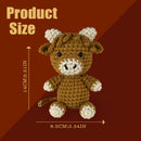 Crocheted bear toy with measurement details on a brown background