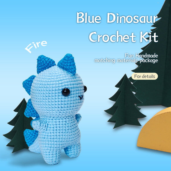 Crocheted blue dinosaur toy with trees on a blue background, labeled 'Blue Dinosaur Crochet Kit'.