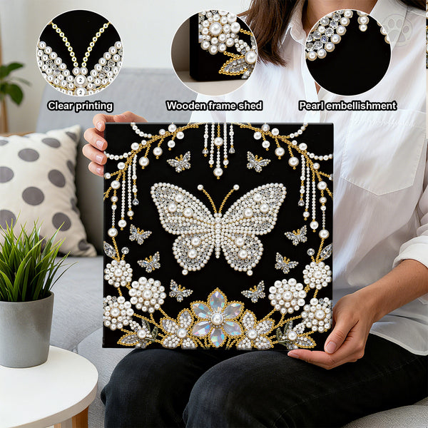 Person holding a decorative panel with a butterfly design, pearls, and flowers, with close-ups of clear printing, wooden frame shed, and pearl embellishment issues.