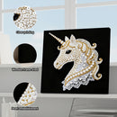 Decorative unicorn art piece with pearl embellishments on a black background, shown with clear printing, wooden frame shedding, and pearl detailing.