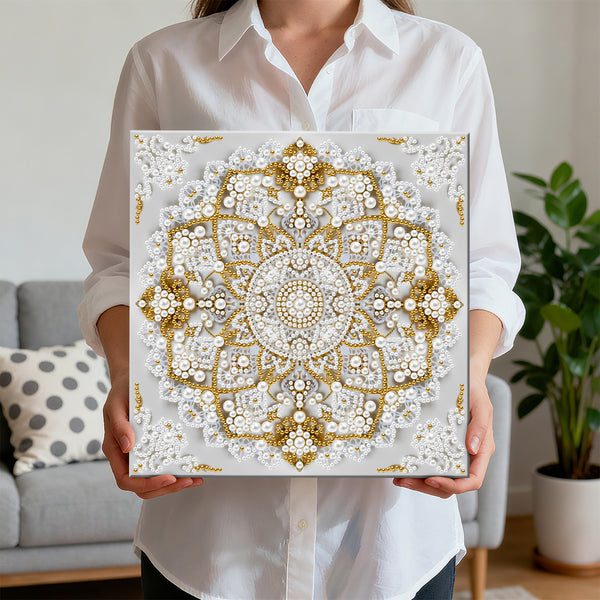 Person holding a decorative wall art piece with a geometric pattern in a living room setting.