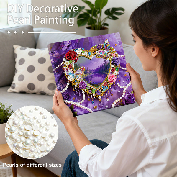 Woman holding a decorative pearl painting with a heart and butterfly design, surrounded by pearls.