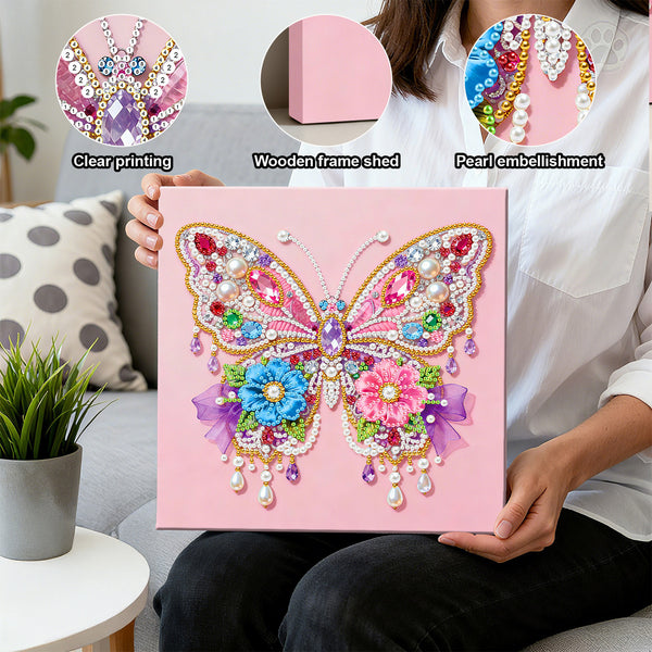 Person holding a pink butterfly diamond painting with clear printing, wooden frame, and pearl embellishments.