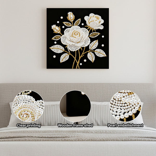 Decorative wall art with floral design on a black background, displayed above a sofa.