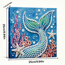 Decorative artwork with mermaid tail, starfish, and coral on a blue background with measurements.