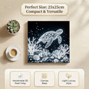 Canvas print of a turtle and coral with a cup and plant on a wooden surface