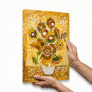 Decorative notebook with sunflower design held by a hand on a white background