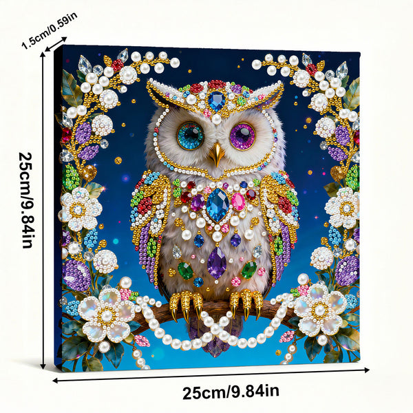 Decorative owl with gemstones and pearls on a blue background, with dimensions indicated.