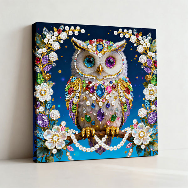 Decorative owl painting with gemstones and flowers on a blue background
