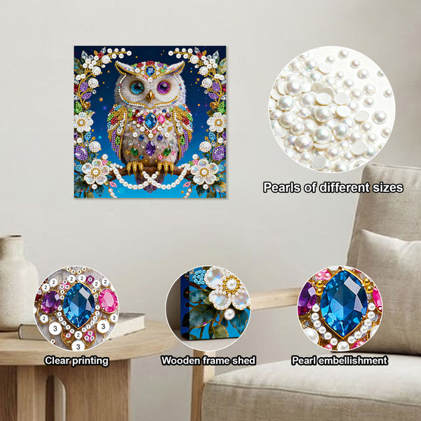 Decorative owl painting with pearl embellishments on a table, surrounded by pearls of different sizes.