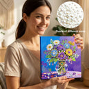 Woman holding a diamond painting kit with a close-up of pearls on a blurred background