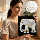Woman holding a completed pearl art of an elephant with close-up of pearls inset.
