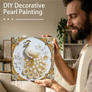Man holding a completed DIY decorative pearl painting of a peacock