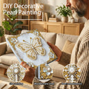 Person holding a decorative item with pearl embellishments in a living room setting