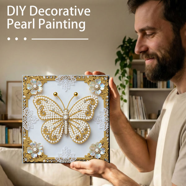 Man holding a DIY decorative pearl painting of a butterfly