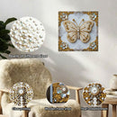 Decorative butterfly wall art with pearls and clear printing on a neutral background.