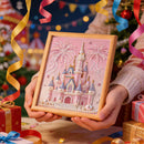 Hand holding a framed decorative castle with fireworks against a festive background with Christmas decorations.