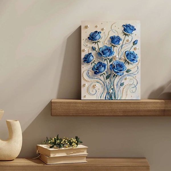 Decorative painting of blue roses on a wooden shelf with books and a vase.