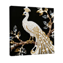 Decorative wall art of a peacock with pearls and gold on a black background