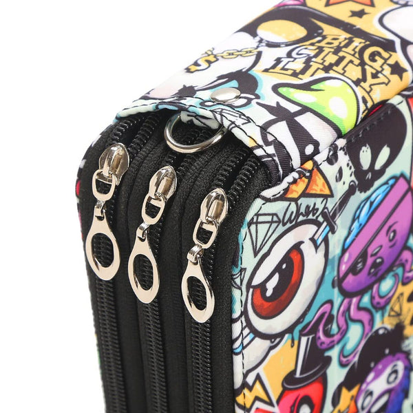 Close-up of a zippered pouch or wallet with a black zipper track and four silver-tone triple zippers, featuring a colorful graffiti-style cartoon print on a white background.