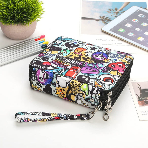 Colorful patterned wallet with a chain on a white surface with stationery items.