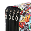 Close-up of a colorful graffiti-print pouch with four black zippers and silver metal pulls, featuring cartoon characters and text including 'WOW! Brains!'.