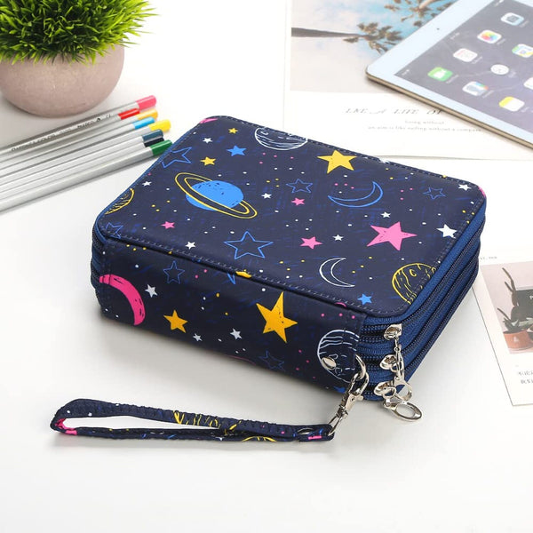 Blue pouch with space-themed design on a white surface