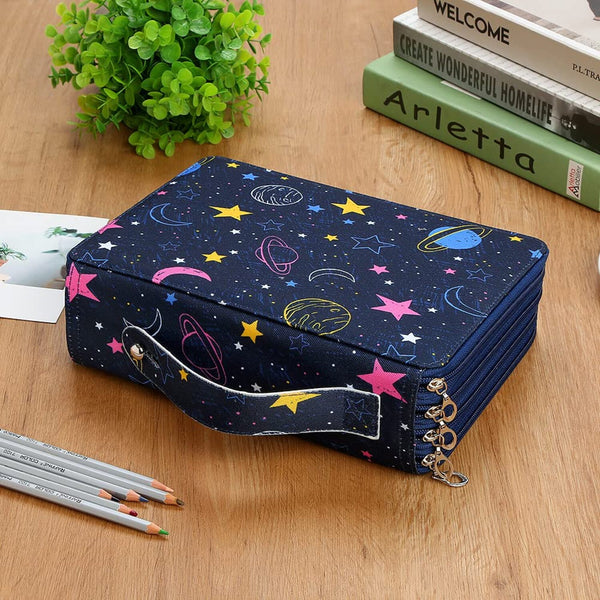 Navy blue cosmetic bag with space-themed design on a wooden surface with books and pencils.