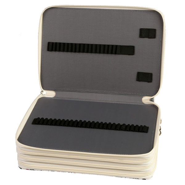 An open zippered hard case with a cream-colored exterior and dark gray interior padding, featuring black elastic band loops on both the inside lid and base, shown on a white background.