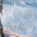 Set of clear silicone mold stencils with various shapes including a coffee cup, lamp, plate, carafe, teapot, and candlestick.