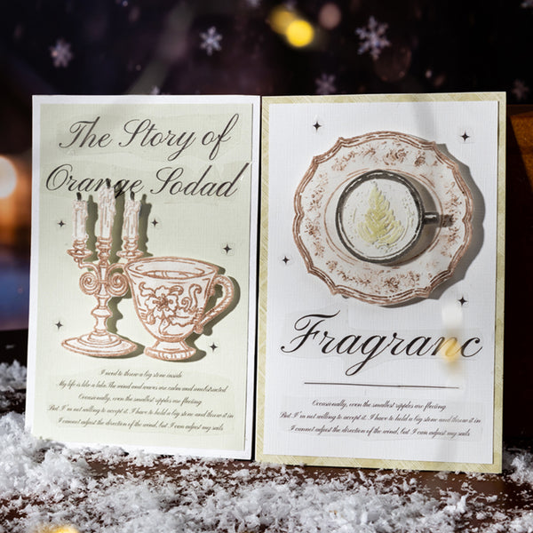 Open book with illustrations of a cup and saucer and text on a snowy background