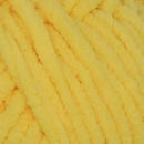 Close-up of yellow yarn texture