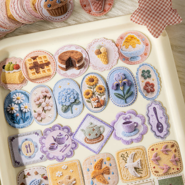 Collection of embroidered patches with various designs on a light surface.